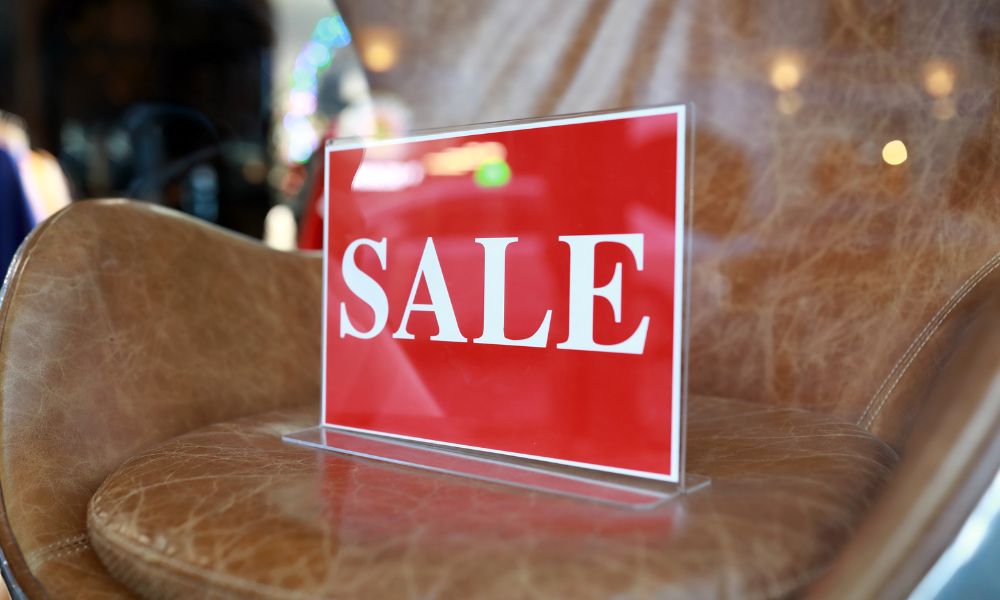 Sales sign in a leather chair